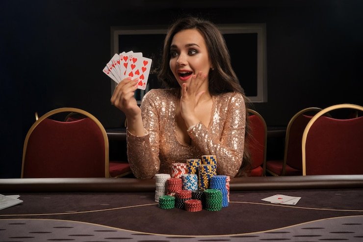 Dealer profesional di studio 1bet menjalankan permainan meja langsung dengan kamera multi-sudut